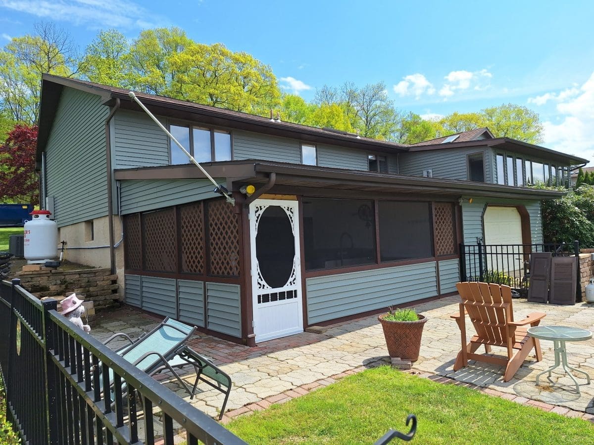 A view of a vinyl-sided home from the backyard.